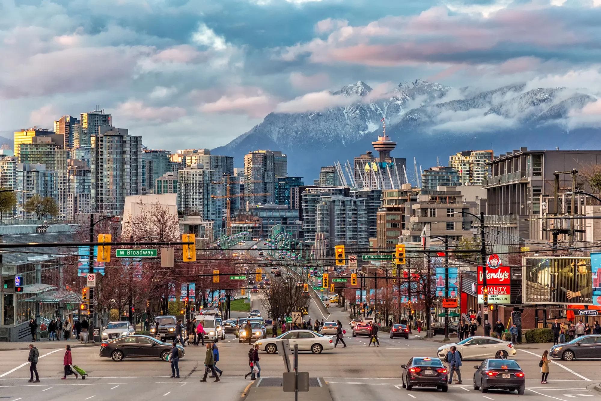 A view of Vancouver downtown with a snow-covered mountain in the background. 