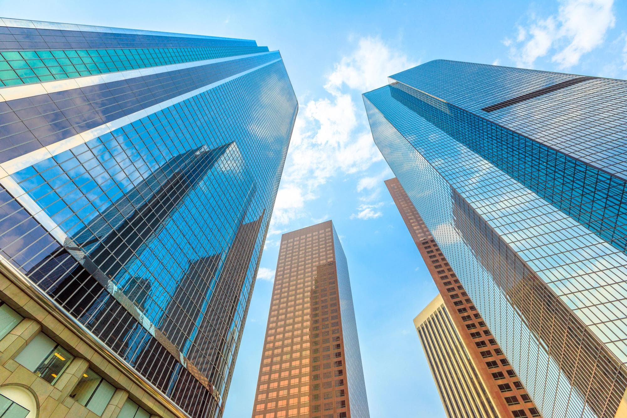 A vertical perspective of skyscrapers in downtown Los Angeles on a sunny day. 