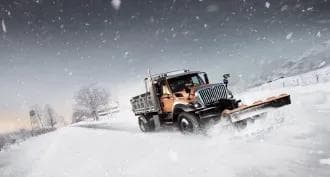 Snowplow working to remove snow from a Canadian street in winter