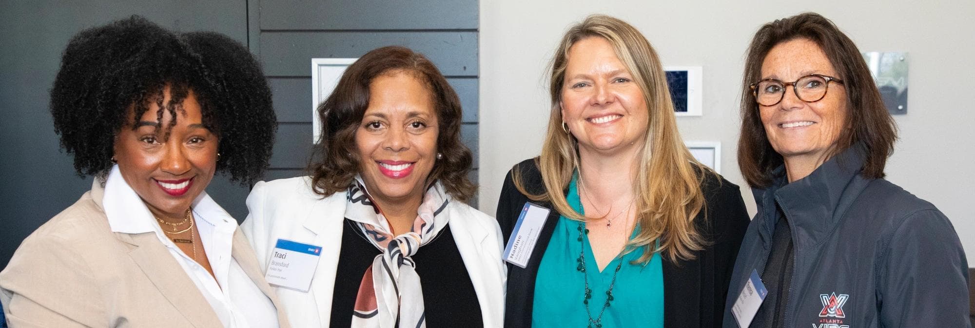 Panelists smiling at the event in Atlanta, Georgia.