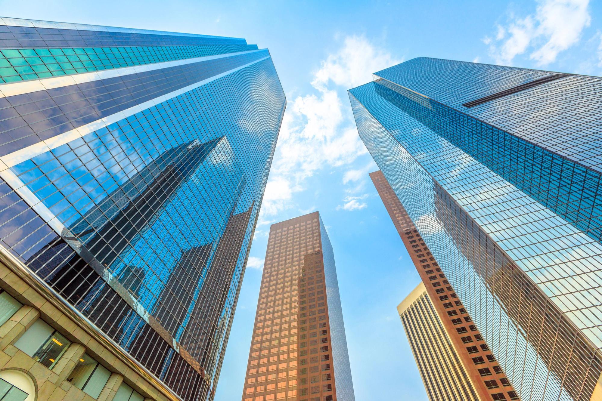 A vertical perspective of skyscrapers in downtown Los Angeles on a sunny day. 