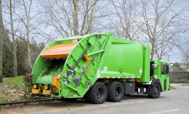 Green recycling truck