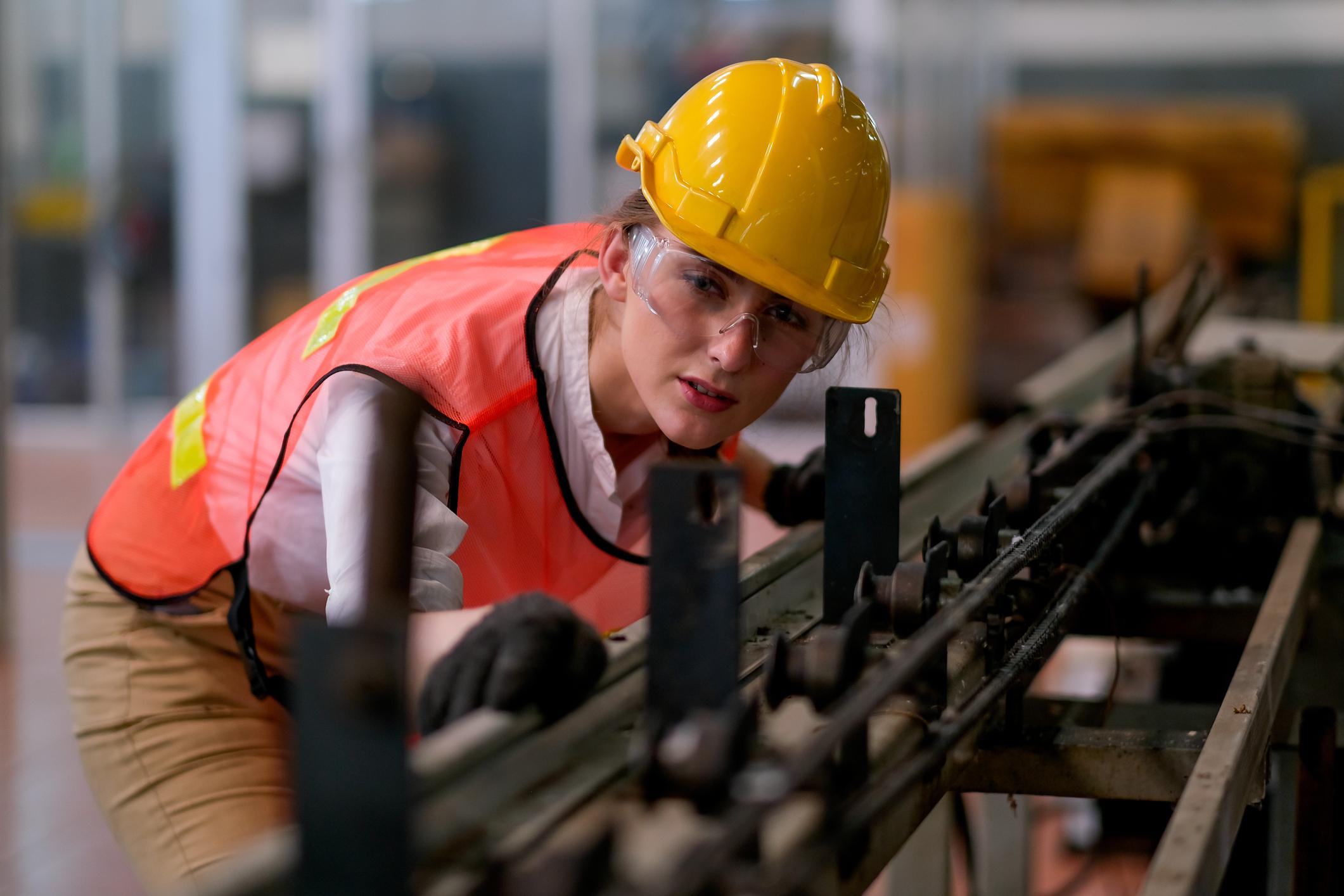 Woman looking at machinery