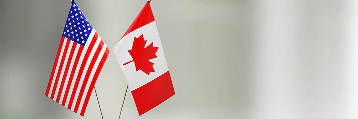 American and Canadian flags