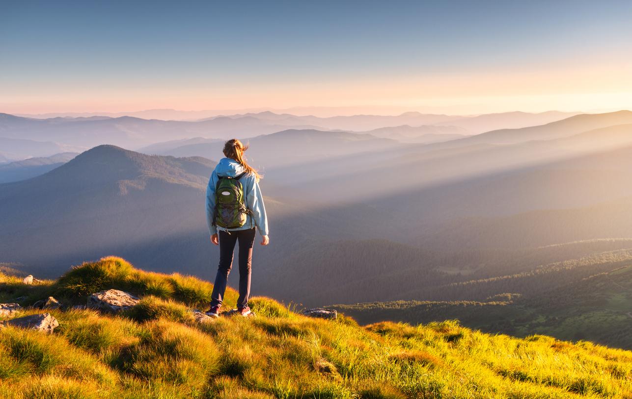 woman standing on hill