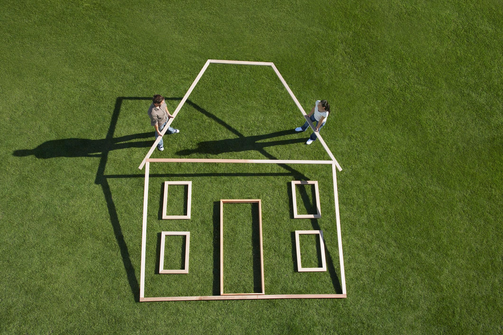Building a house on a green lawn