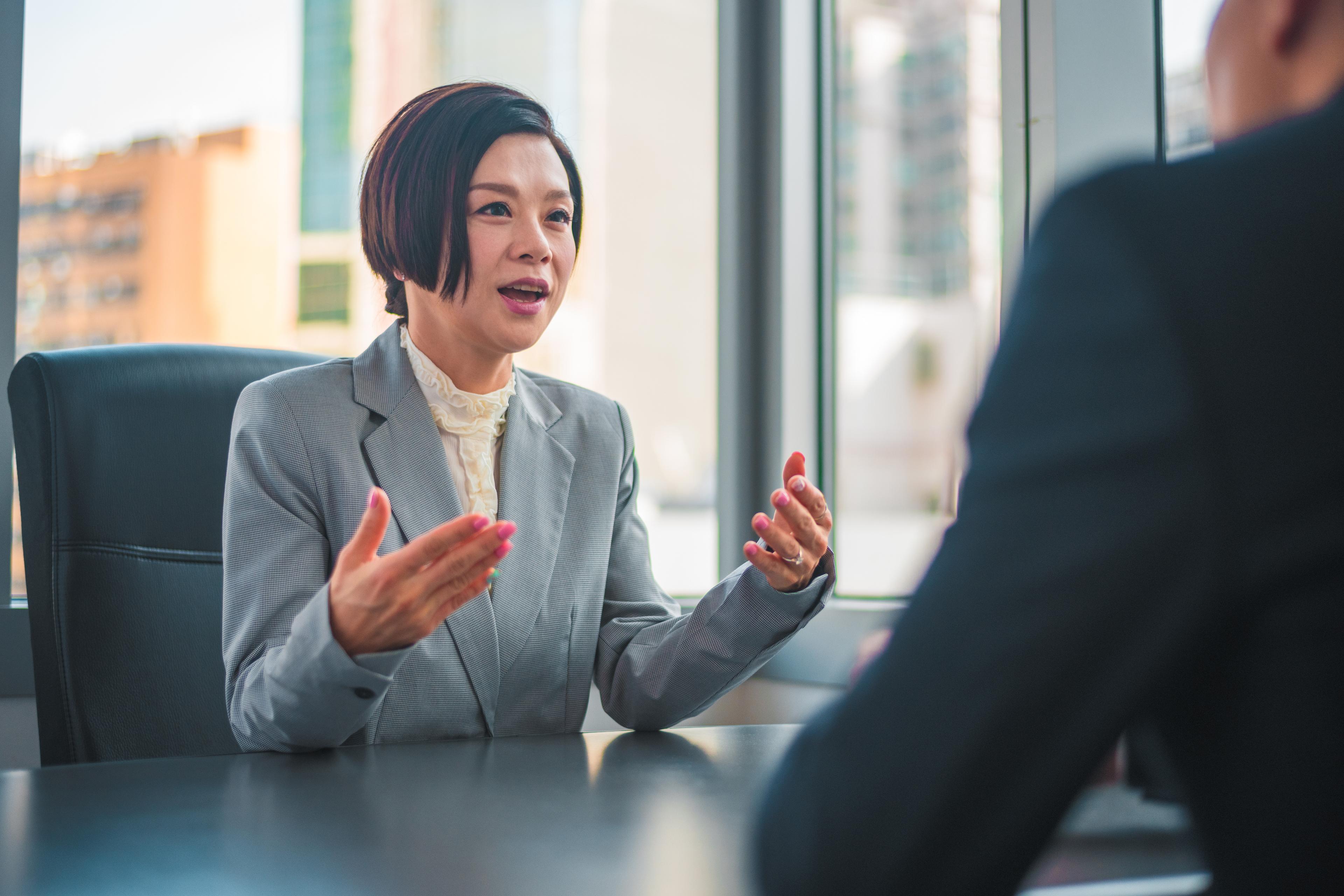 Woman sitting in corporate office