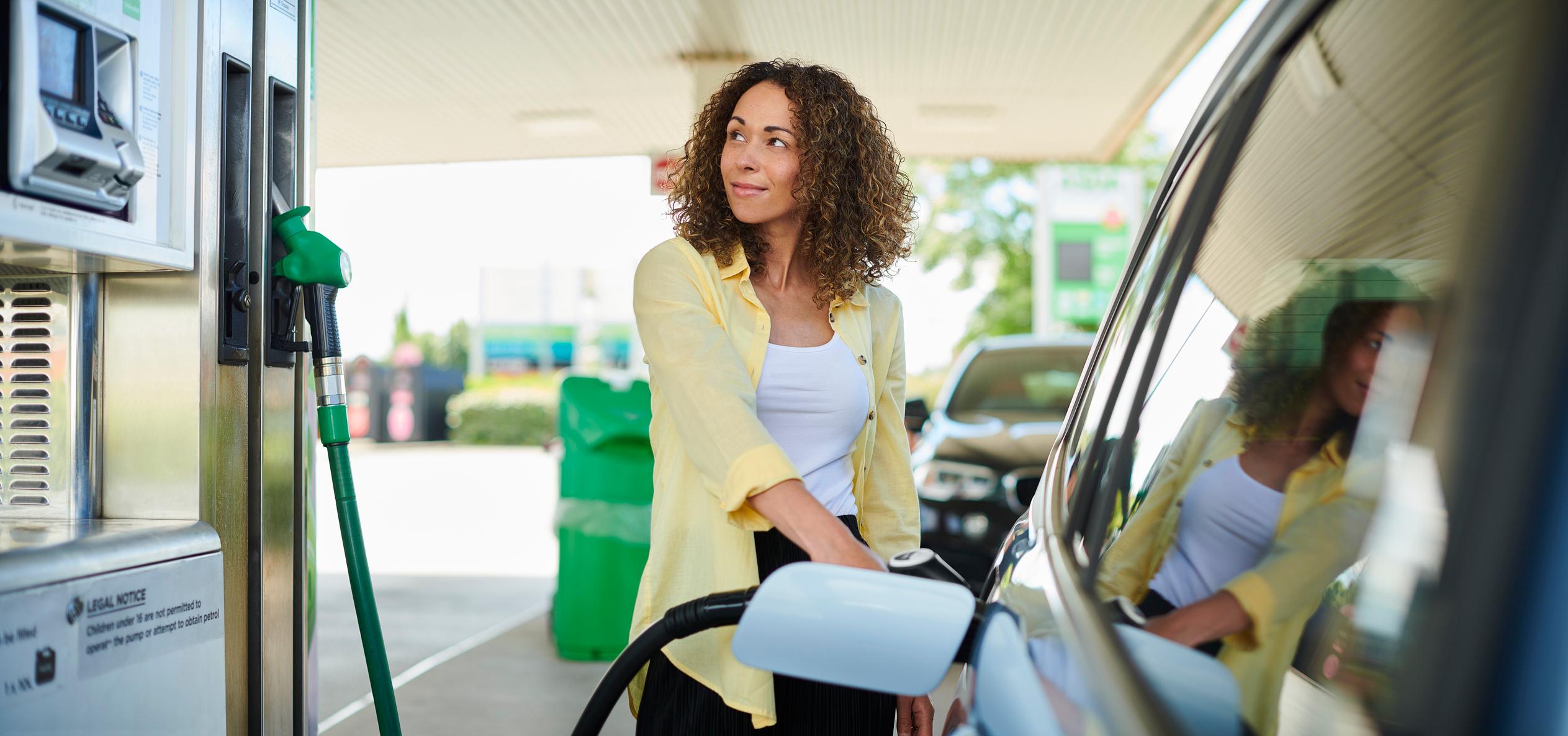 Gas Station and man fueling car