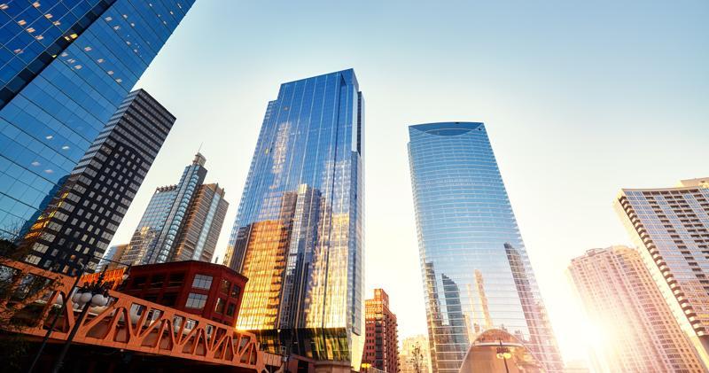 A bridge in Chicago with skyscrapers looming over it.