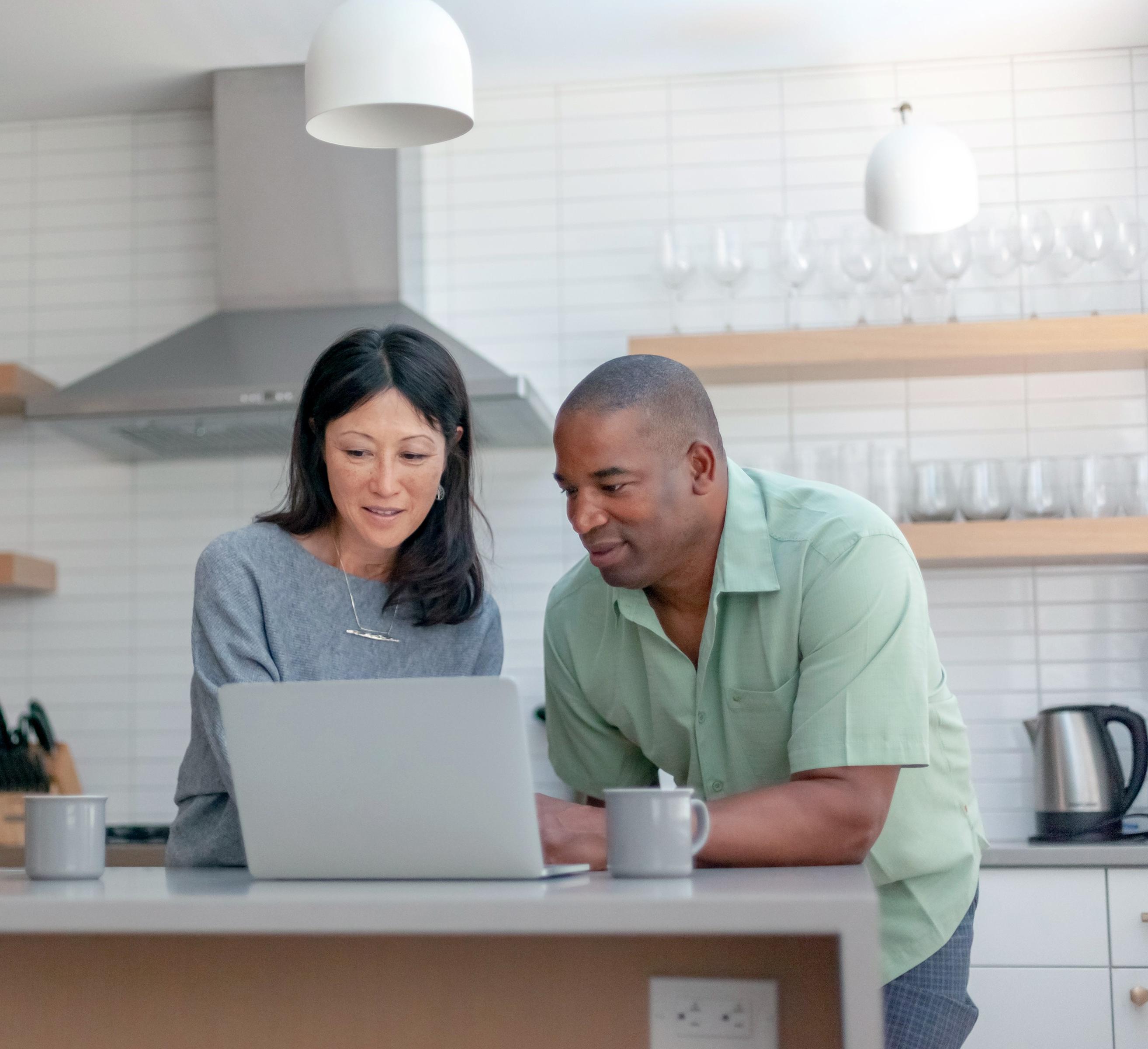 Two people with a laptop