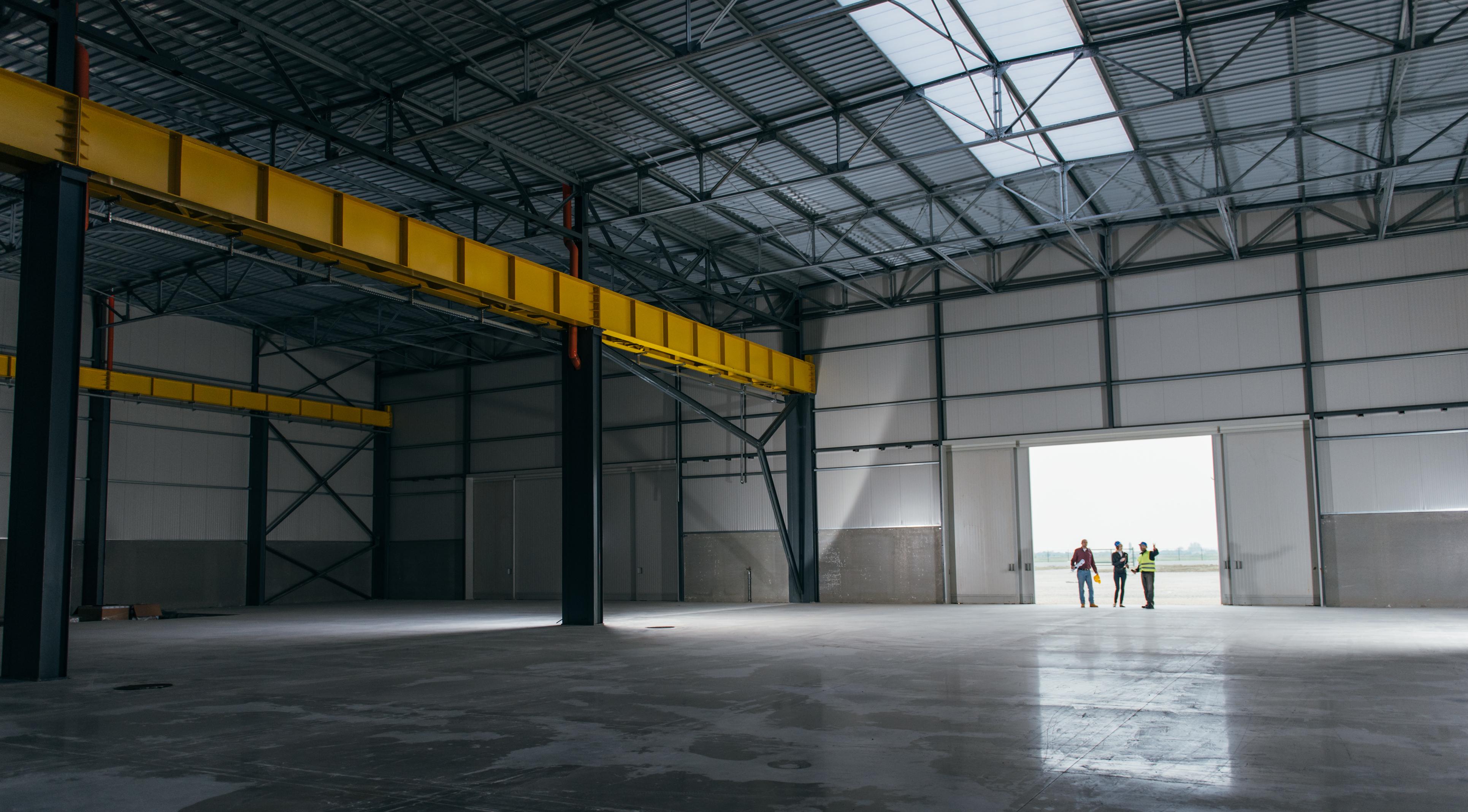 Executives walking through a new warehouse.