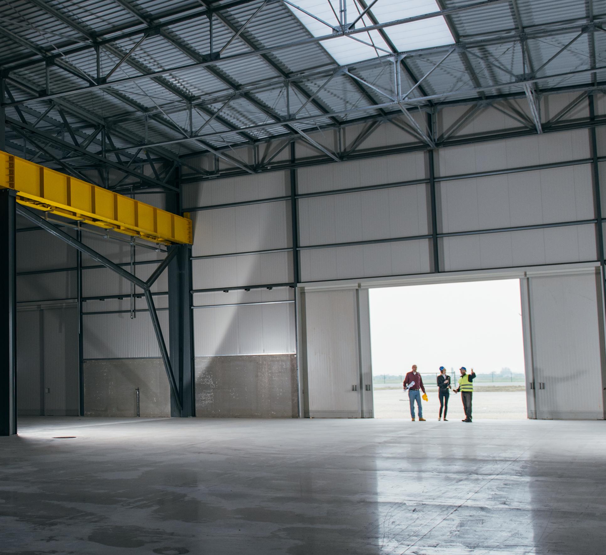 Executives walking through a new warehouse