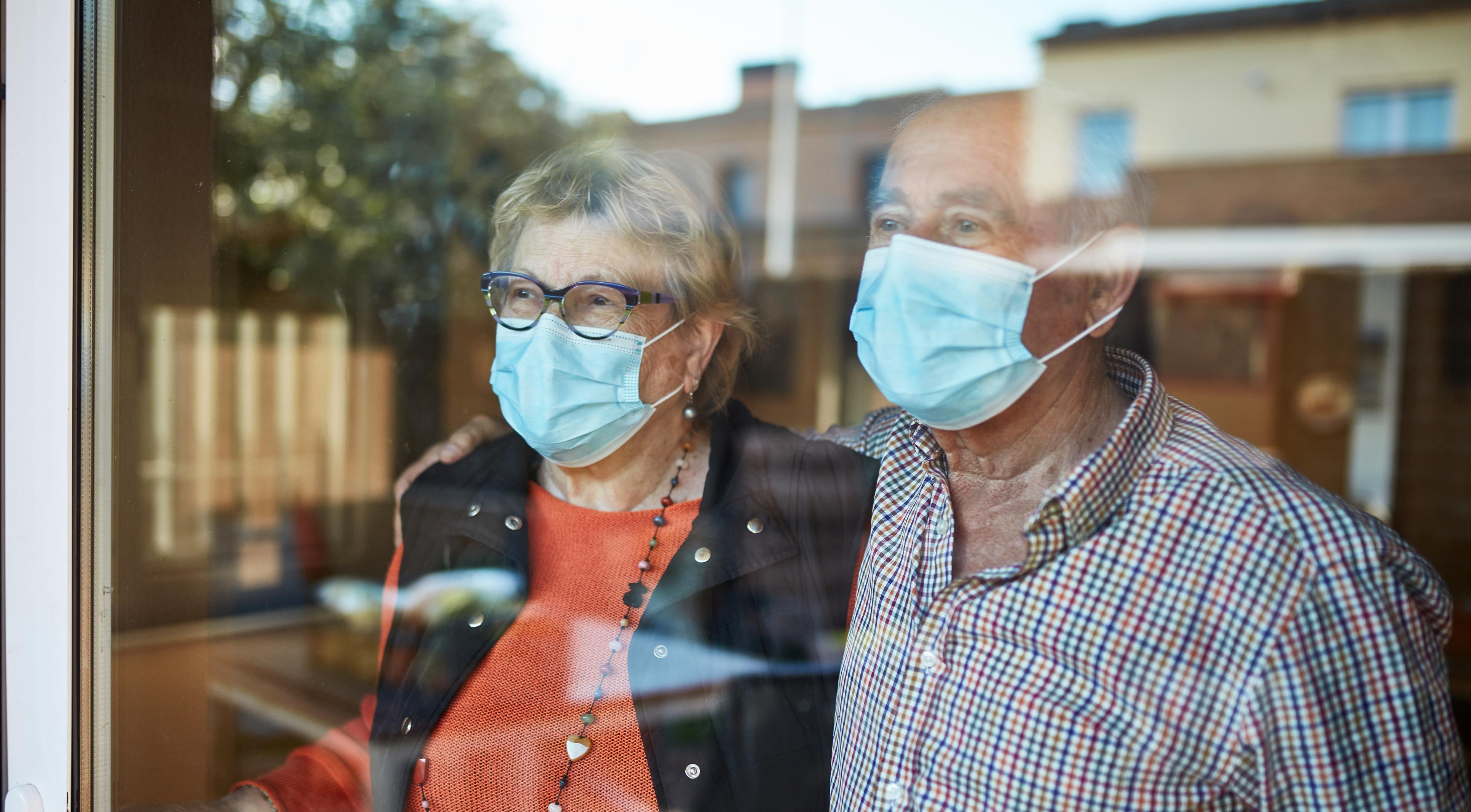 Seniors in an independent living facility wearing masks to protect from COVID-19.