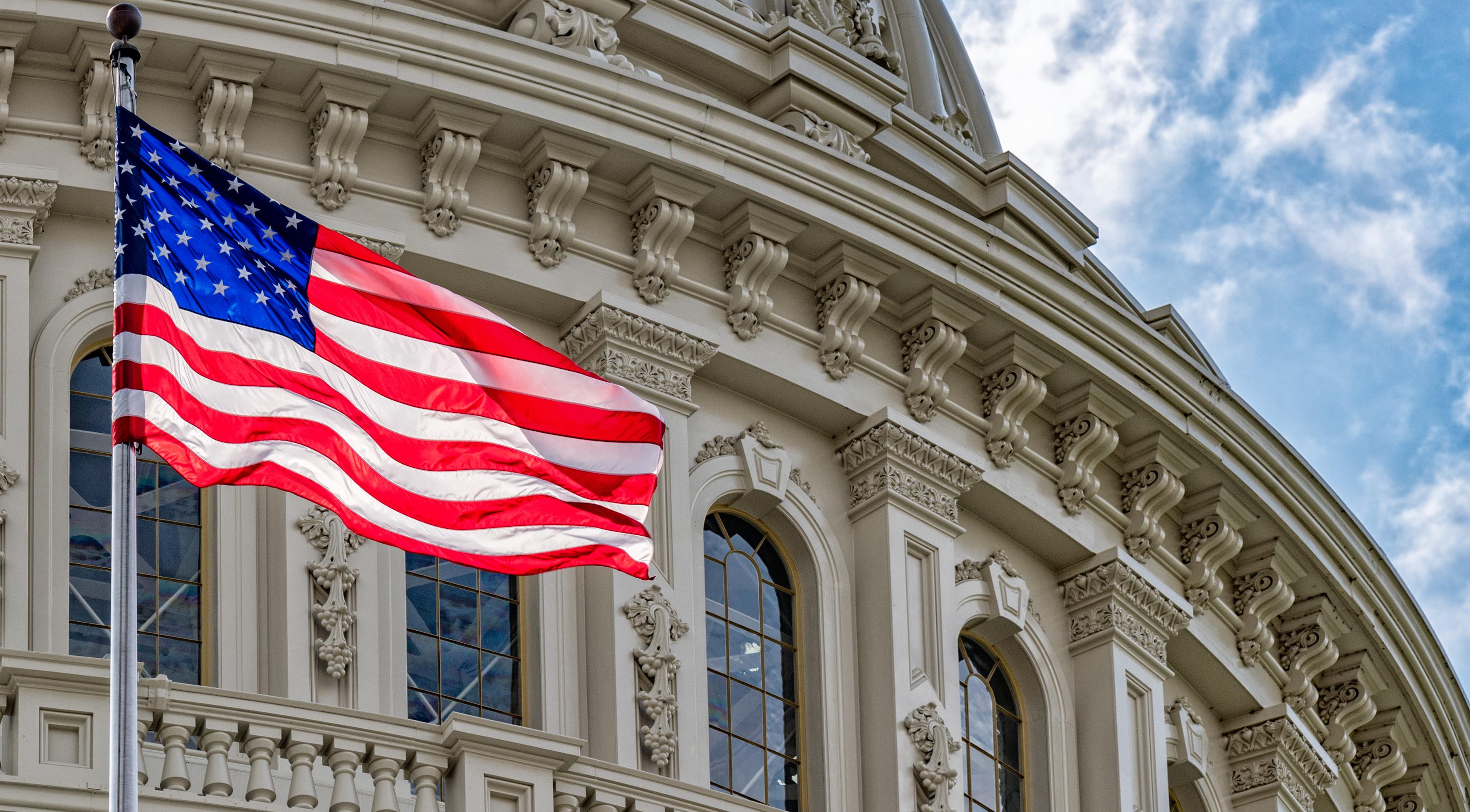 U.S. flag in front of Washington Capitol dome