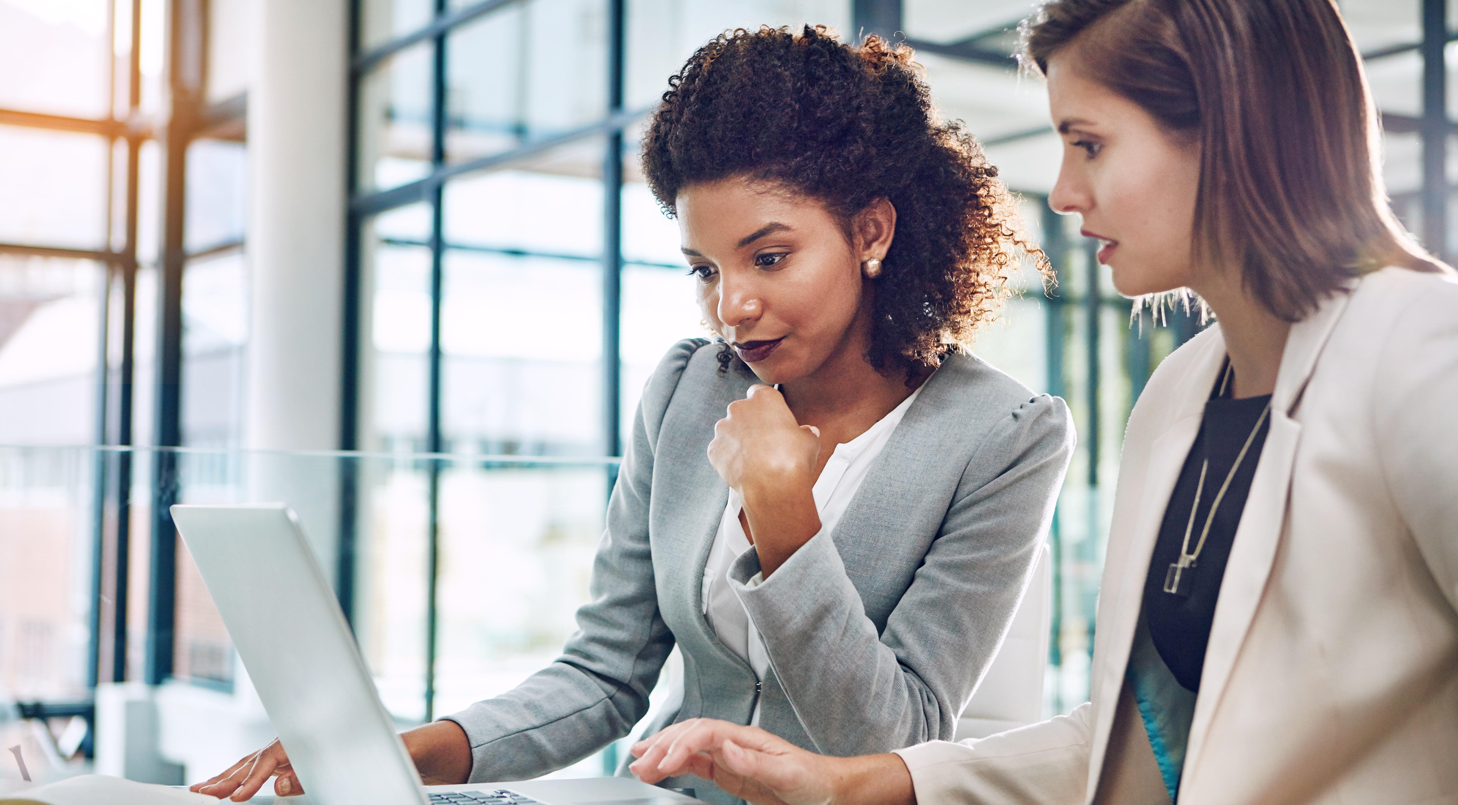 two women with laptop.