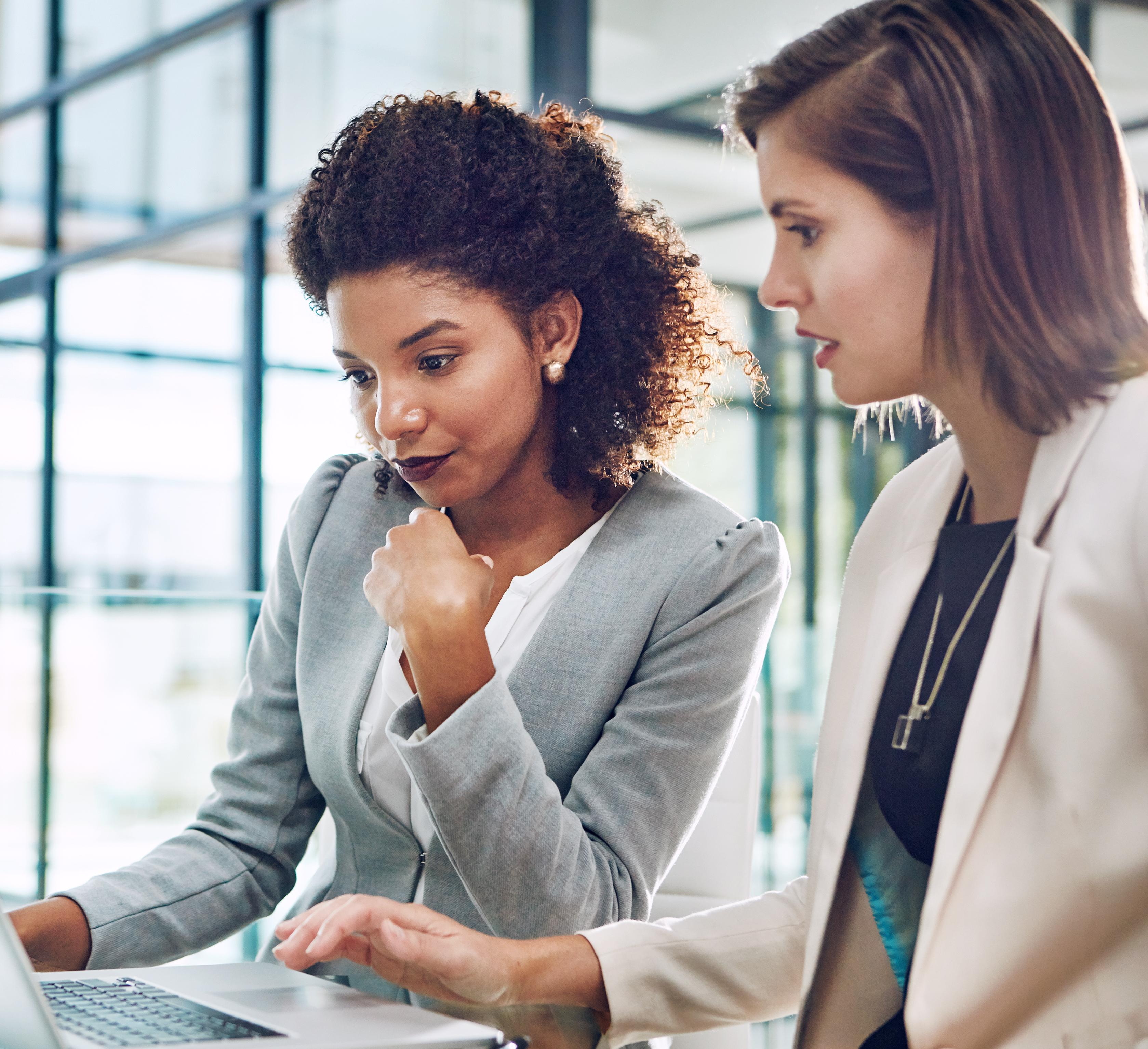 two women with laptop