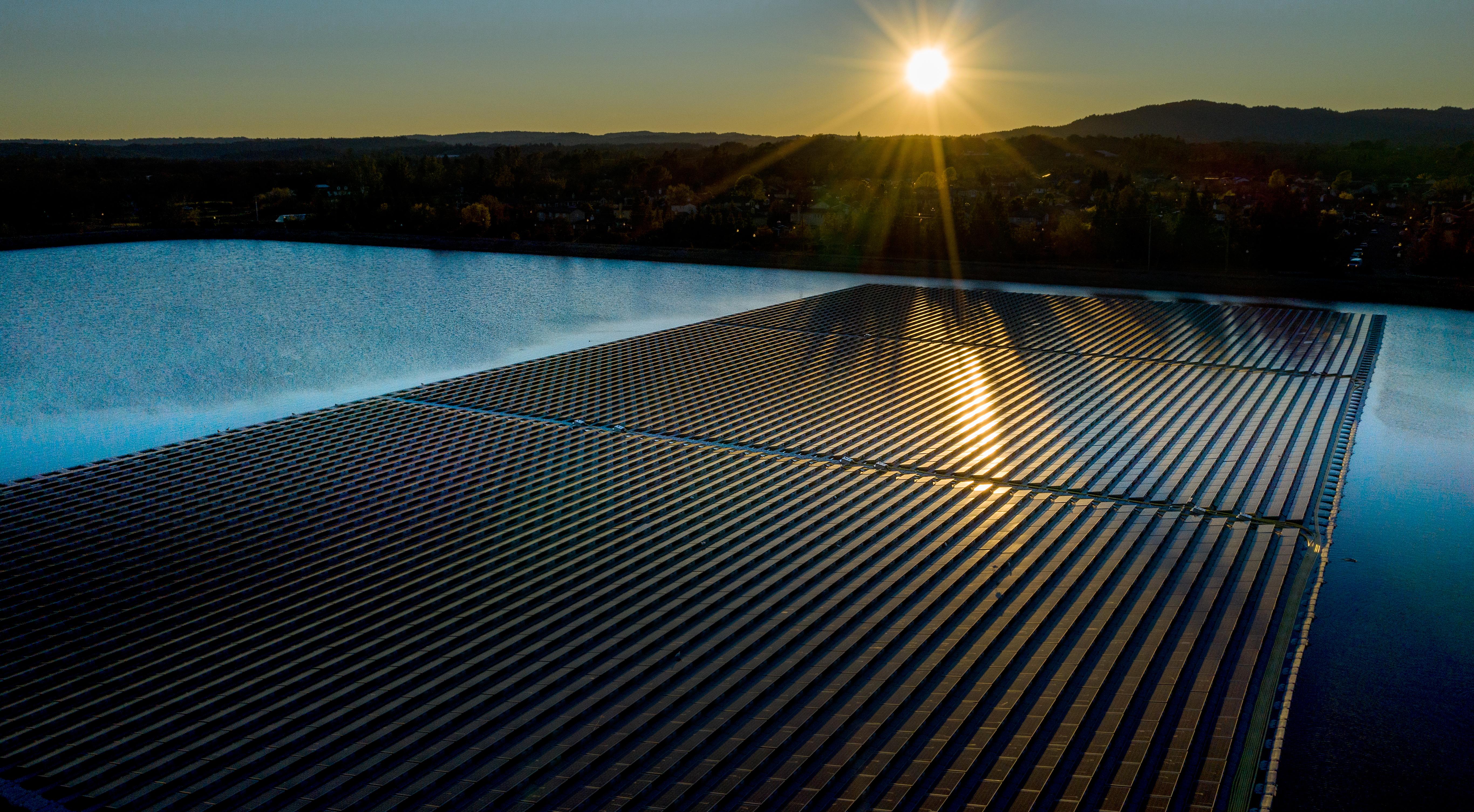 Floating solar panels in the Town of Windsor, Calif., installed by Ciel et Terre, during a sunrise.