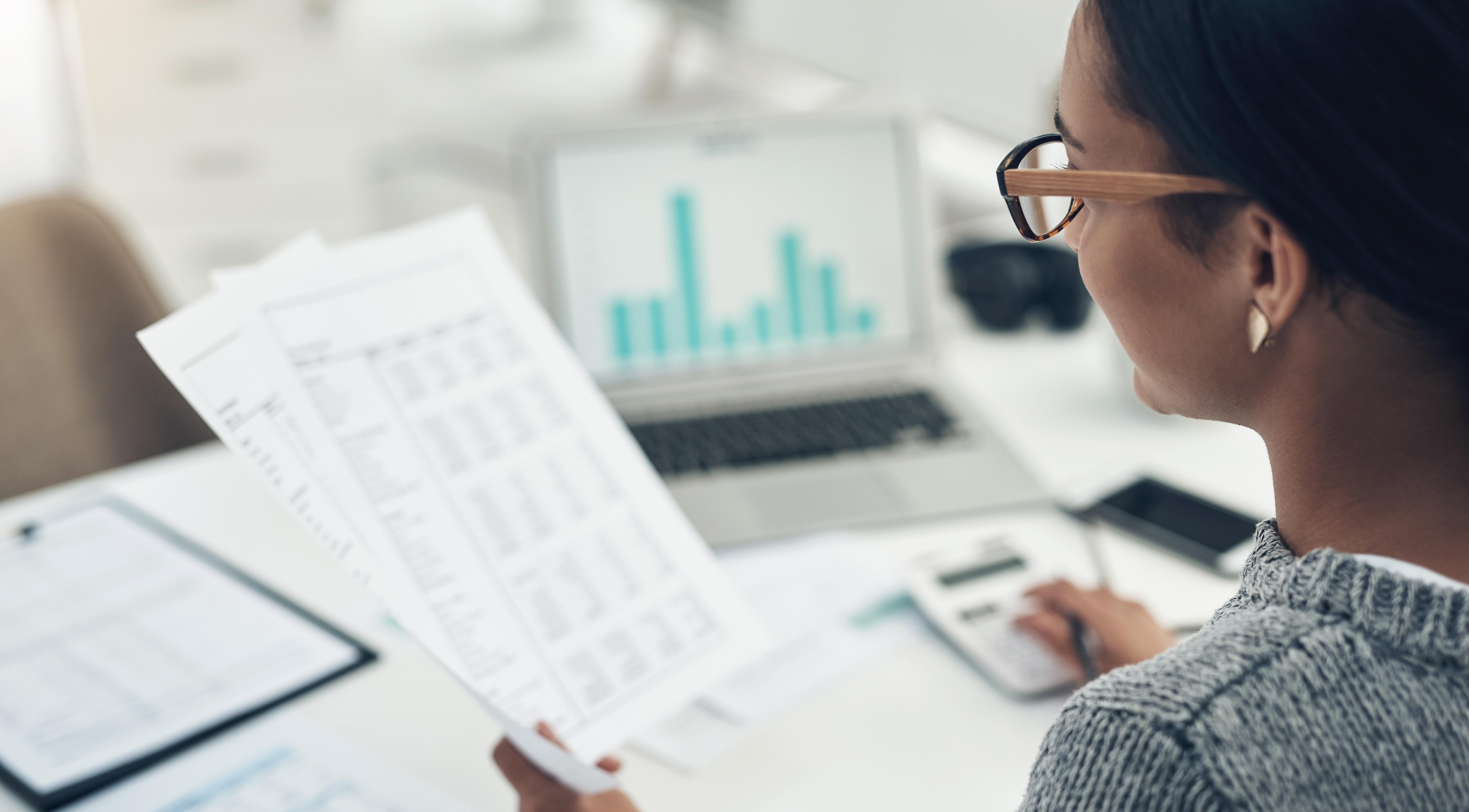 Woman reading financial statements.