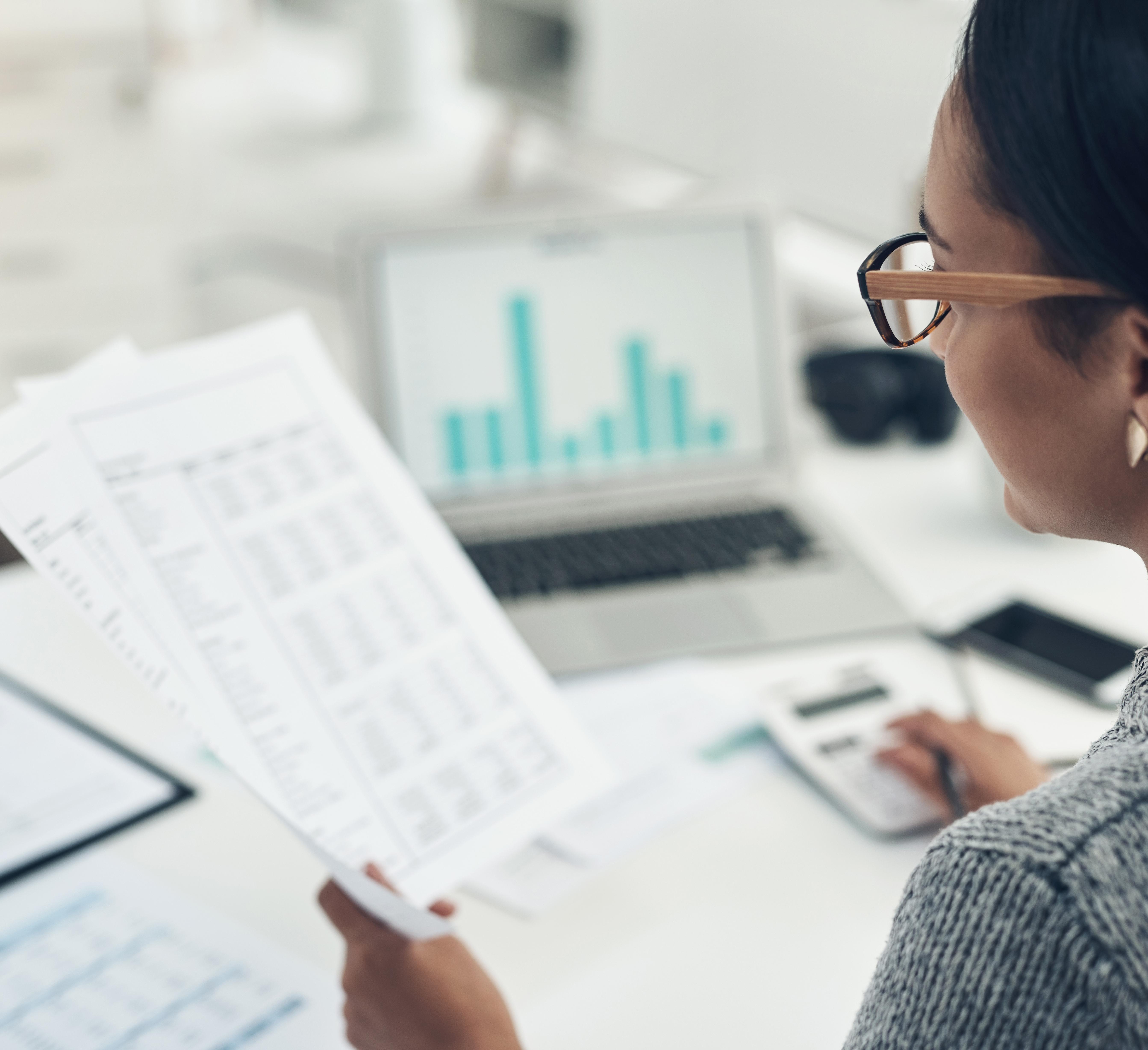 Woman reading financial statements