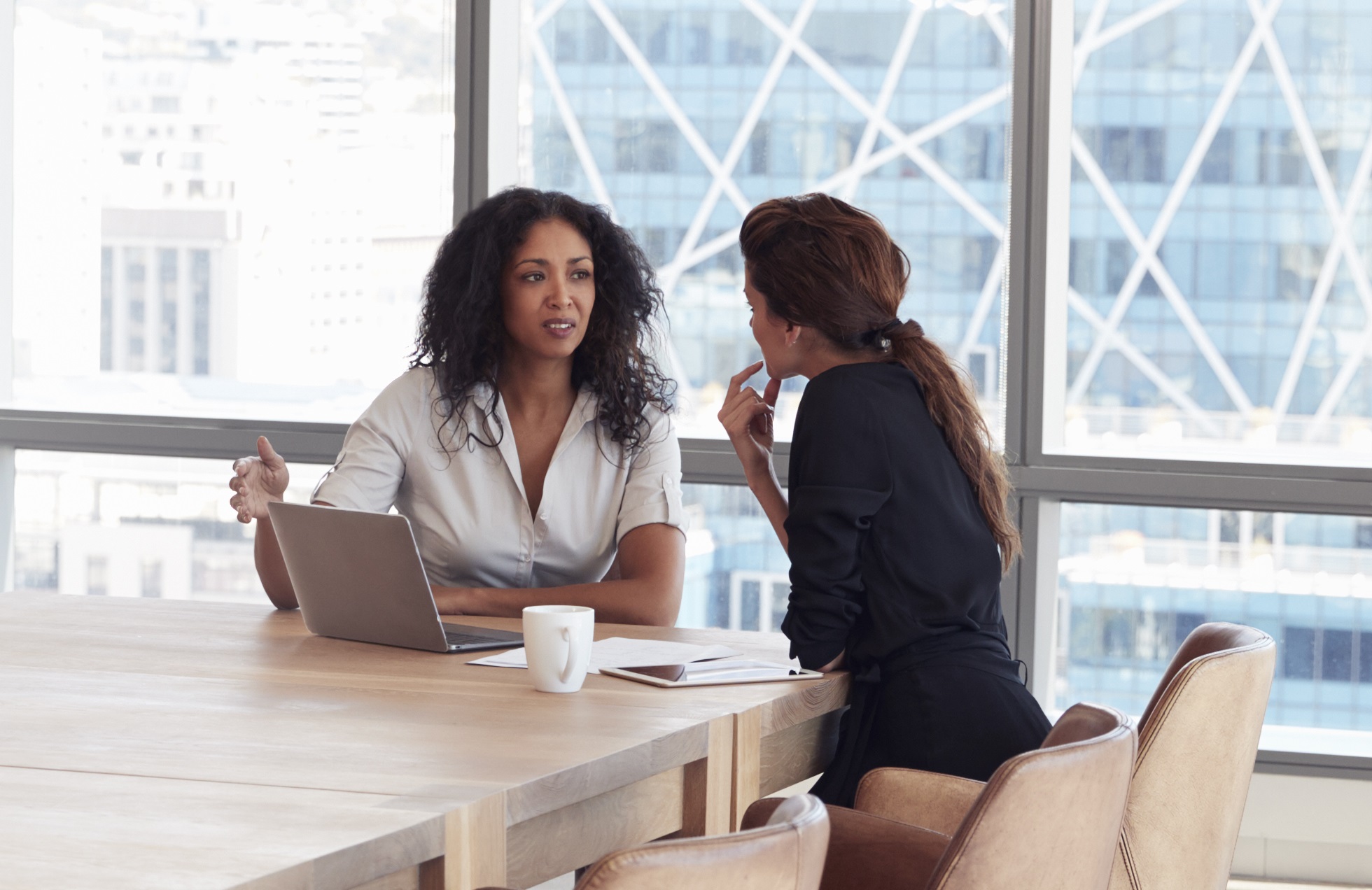 two women discussing financials