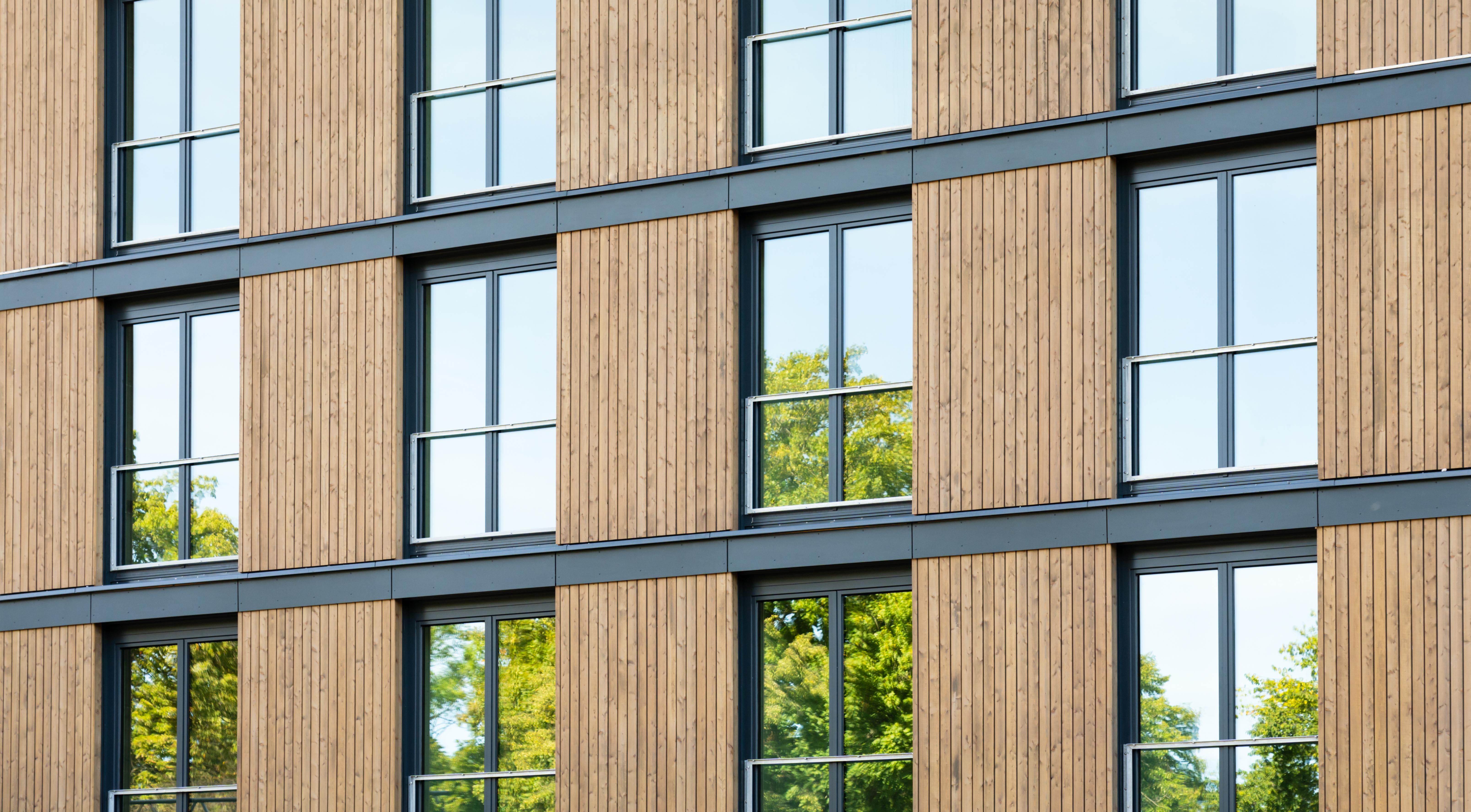 Apartment building with a wood facade.
