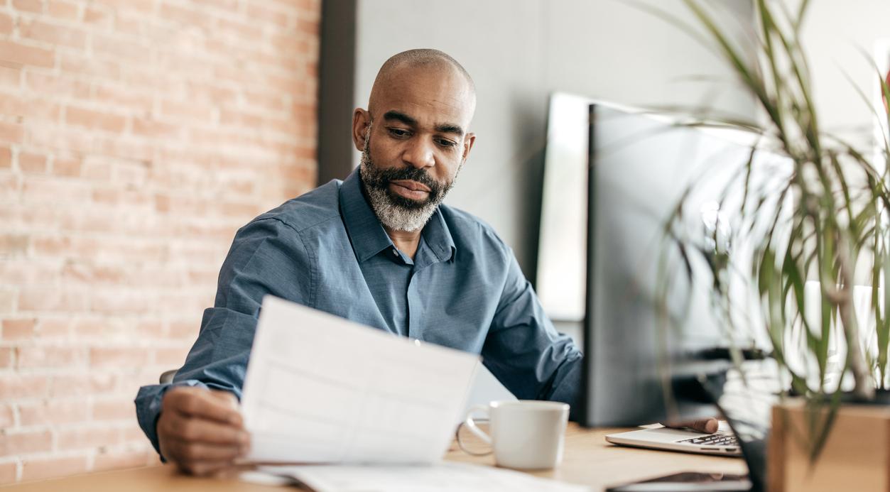 Employee looking at financial portfolio.